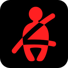 Red seat belt light on a black background
