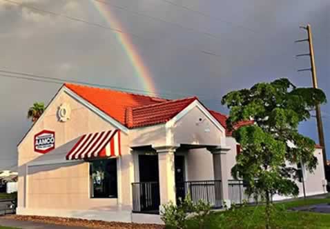 AAMCO Venice, FL exterior with rainbow